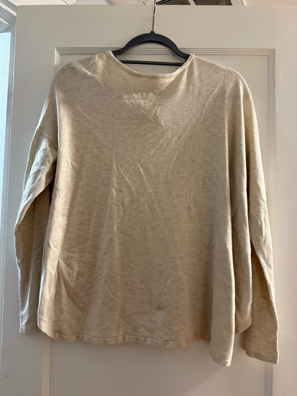 Fabletics woman’s long sleeve shirt with open back.